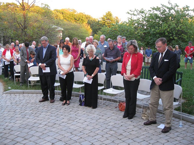 Fairfax County Supervisor John Foust, Virginia State Senator Barbara Favola, Friend of the Freedom Memorial Sara Hilgartner, U.S. Representative Barbara Comstock, and Drug Enforcement Administration Acting Director Chuck Rosenberg observe a moment of silence at the Freedom Memorial in Great Falls, Virginia on September 11, 2016