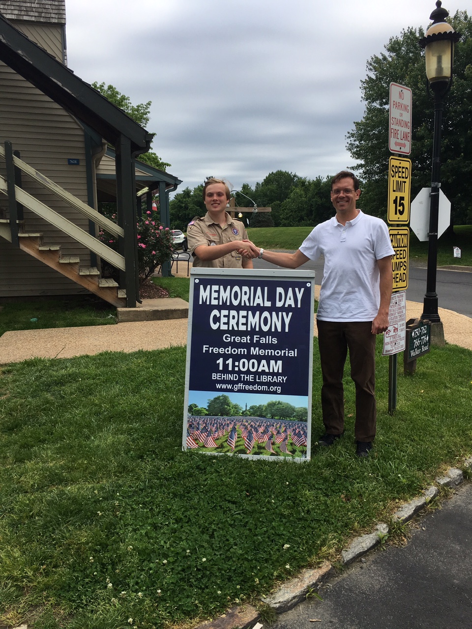 Boy Scout Alex Bonadio with finished sign and Freedom Memorial director Bruce Fein