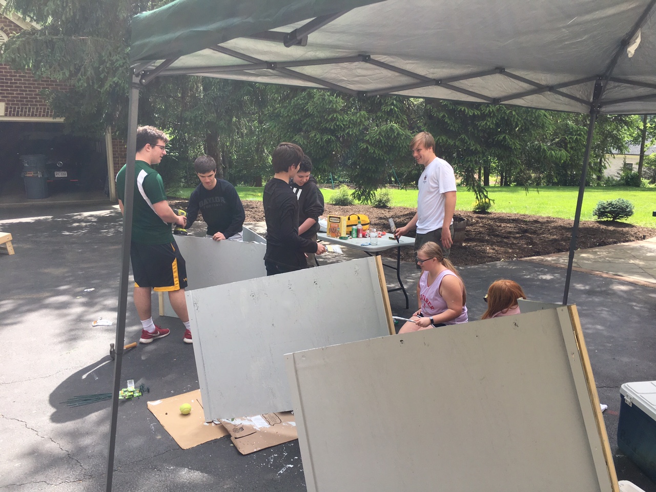 Scouts at work constructing signs